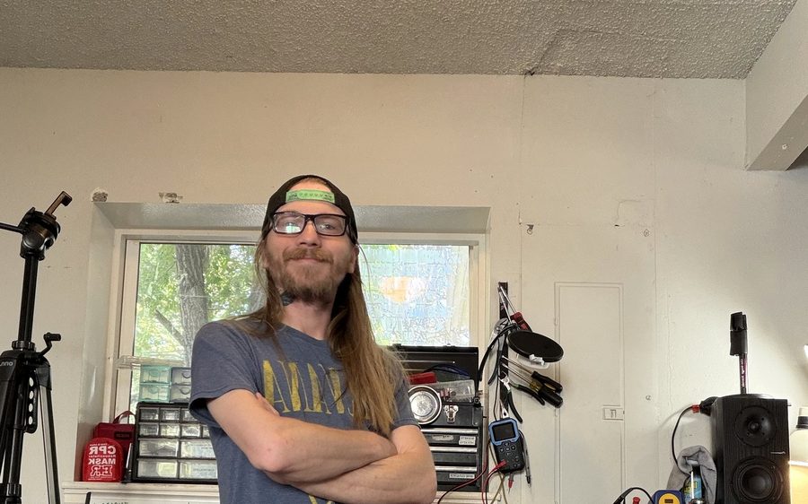Tj at the repair bench in the Longmont shop